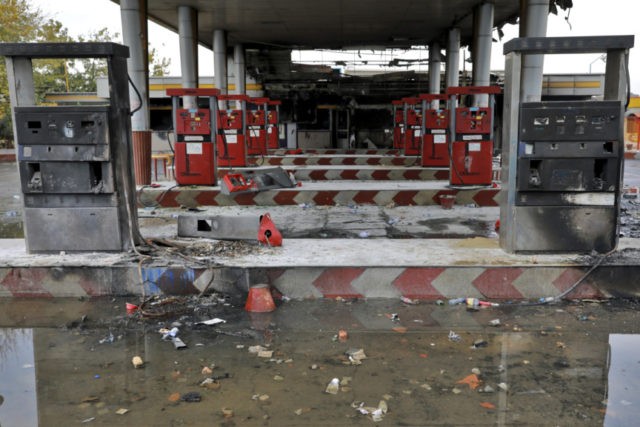 Iran In this Nov. 20, 2019, file photo, rainwater pools at a gas station attacked during protests over government set gasoline prices in Tehran, Iran. Amnesty International says at least 208 people in Iran have been killed amid protests over sharply rising gasoline prices and a subsequent crackdown by security forces. The country has yet to release any nationwide statistics about the unrest last month. (AP Photo/Ebrahim Noroozi, File) The Associated Press
