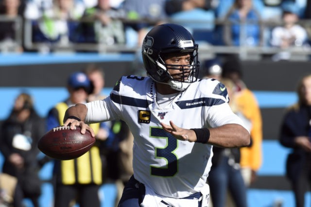 Seahawks Panthers Football Seattle Seahawks quarterback Russell Wilson (3) passes during the first half of an NFL football game against the Carolina Panthers in Charlotte, N.C., Sunday, Dec. 15, 2019. (AP Photo/Mike McCarn) The Associated Press