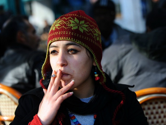 A Tunisian girl smokes in a bar in the center of Tunis on February, 2 2011. Tunisia's inte