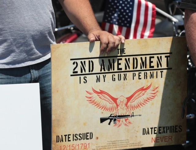 LAKE BARRINGTON, IL - JUNE 17: Counter-demonstrators show support for DSA Inc as anti-gun demonstrators protest outside the gun manufacturing facility on June 17, 2016 in Lake Barrington, Illinois. DSA Inc. manufactures FAL, AR15 and RPD rifles. (Photo by Scott Olson/Getty Images)