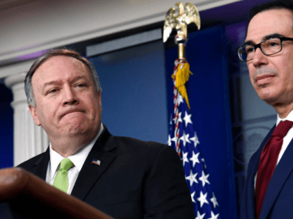 Treasury Secretary Steven Mnuchin, right, and Secretary of State Mike Pompeo, left, participate in a briefing at the White House in Washington, Friday, Jan. 10, 2020. (AP Photo/Susan Walsh)