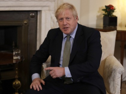 Britain's Prime Minister Boris Johnson looks to the cameras as he and European Commis