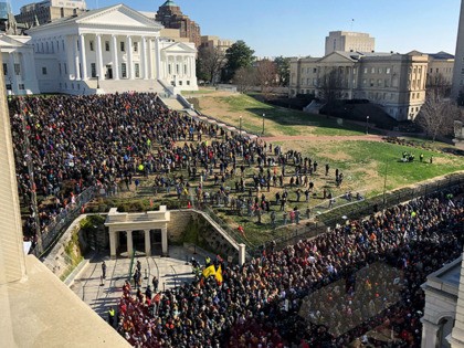Demonstrators are seen during a pro-gun rally, Monday, Jan. 20, 2020, in Richmond, Va. Thousands of pro-gun supporters are expected at the rally to oppose gun control legislation like universal background checks that are being pushed by the newly elected Democratic legislature. (AP Photo/Sarah Rankin)
