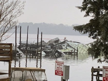 The remains of a dock where at least 35 vessels, many of them houseboats, were destroyed b