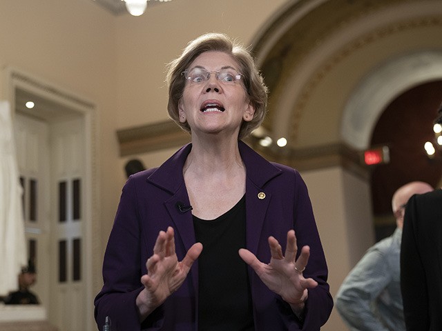 Sen. Elizabeth Warren, D-Mass., speaks during a television news interview during a break in the impeachment trial of President Donald Trump on charges of abuse of power and obstruction of Congress, at the Capitol in Washington, Monday, Jan. 27, 2020. (AP Photo/J. Scott Applewhite)
