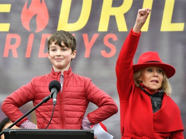 Child actor Iain Armitage speaks during a climate rally as actress Jane Fonda (R) watches on the grounds of the US Capitol in Washington, DC on on January 3, 2020. (Photo by MANDEL NGAN / AFP) (Photo by MANDEL NGAN/AFP via Getty Images)