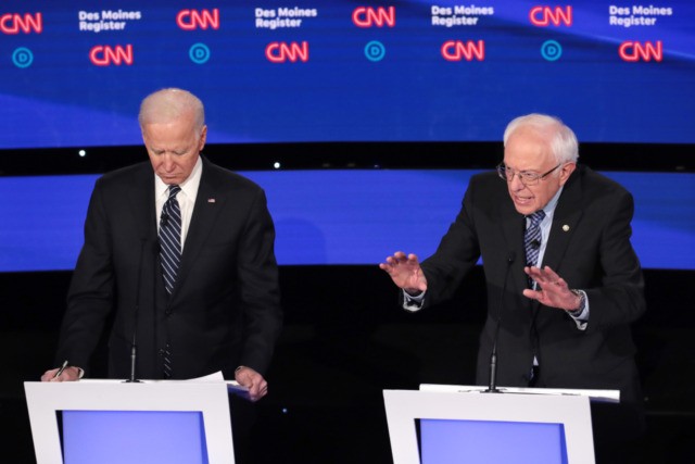 DES MOINES, IOWA - JANUARY 14: Former Vice President Joe Biden (L) listens as Sen. Bernie Sanders (I-VT) makes a point during the Democratic presidential primary debate at Drake University on January 14, 2020 in Des Moines, Iowa. Six candidates out of the field qualified for the first Democratic presidential …