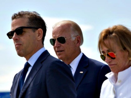 Family members gather for a road naming ceremony with U.S. Vice President Joe Biden, centr
