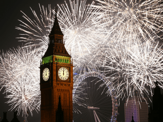 LONDON, ENGLAND - JANUARY 01: Fireworks light up the London skyline and Big Ben just after