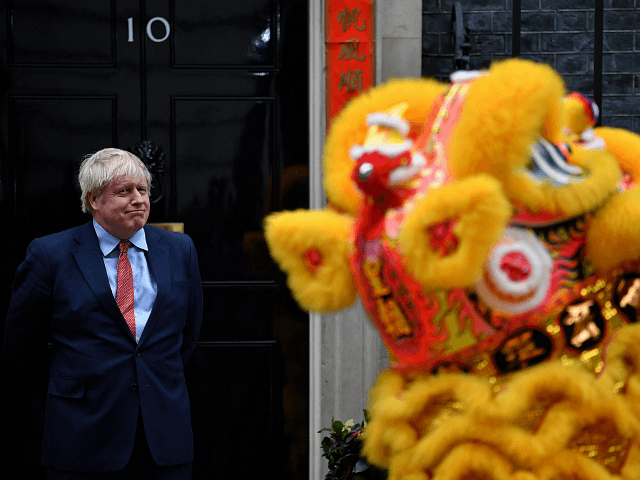 Britain's Prime Minister Boris Johnson reacts as he hosts a Chinese New Year reception at