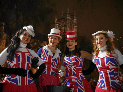 Brexit supporters dressed in Union flag-themed clothes, pose for a photograph as they wait for the festivities to begin in Parliament Square, the venue for the Leave Means Leave Brexit Celebration in central London on January 31, 2020, the day that the UK formally leaves the European Union. - Brexit …