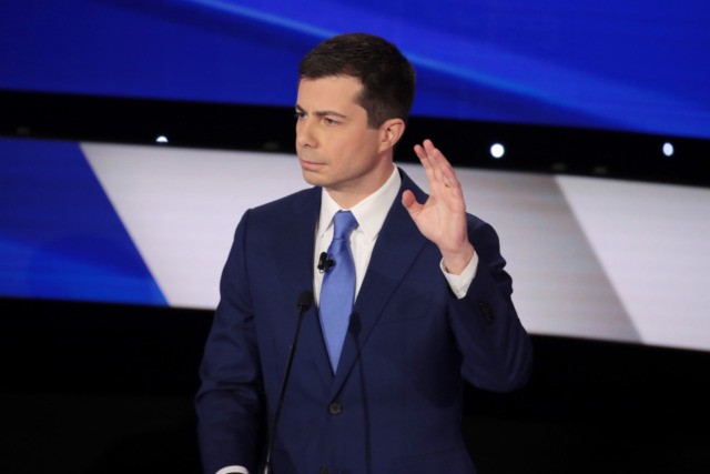 DES MOINES, IOWA - JANUARY 14: Former South Bend, Indiana Mayor Pete Buttigieg raises his hand during the Democratic presidential primary debate at Drake University on January 14, 2020 in Des Moines, Iowa. Six candidates out of the field qualified for the first Democratic presidential primary debate of 2020, hosted …
