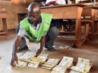 An election worker counts votes after polls closed following the second round presidential and legislatives elections in Bangui, on February 14, 2016. The Central African Republic held delayed presidential and parliamentary polls on February 14, with voters desperate to usher in peace after the country's worst sectarian violence since independence …