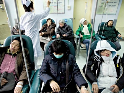 Chinese patients receive medical treatment at a hospital in Beijing, Thursday, Jan. 10, 2008. The rising cost of health care topped Chinese citizens' concerns in a government survey released Wednesday, a day after Beijing announced plans to reform the country's medical system. (AP Photo/Andy Wong)