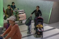 LOS ANGELES, CA - JANUARY 18: People arrive to Los Angeles International Airport after touchdown of an Air China flight from Beijing, which serves as a connector from Wuhan, China to Los Angeles, on the first day of health screenings for coronavirus of travelers from Wuhan on January 18, 2020 …