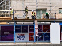 Construction workers put up support scaffolding on the side of a building in Washington, DC on October 8, 2019. - America's jobless rate tumbled in September to its lowest level in 50 years, helping assuage fears of an economic slowdown, according to government data released on October 4, 2019. (Photo …