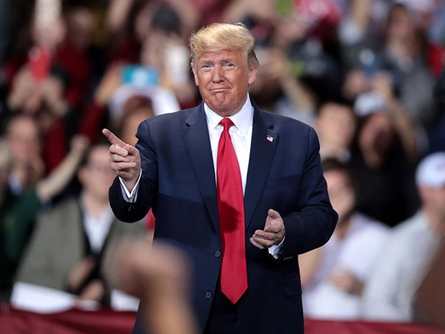 BATTLE CREEK, MICHIGAN - DECEMBER 18: (EDITOR'S NOTE: Alternate crop.) President Donald Trump hosts a Merry Christmas Rally at the Kellogg Arena on December 18, 2019 in Battle Creek, Michigan. While Trump spoke, the House of Representatives was voting on two articles of impeachment, deciding if he will become the …