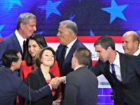 MIAMI, FLORIDA - JUNE 26: Chuck Todd of NBC News greets Sen. Amy Klobuchar (D-MN), former housing secretary Julian Castro, former Texas congressman Beto O'Rourke and other candidates after the first night of the Democratic presidential debate on June 26, 2019 in Miami, Florida. A field of 20 Democratic presidential …