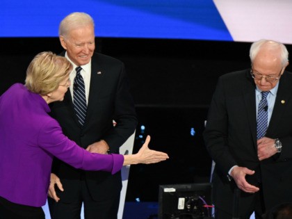 Democratic presidential hopefuls Massachusetts Senator Elizabeth Warren (L), Former Vice President Joe Biden (C) and Vermont Senator Bernie Sanders (R) arrive for the seventh Democratic primary debate of the 2020 presidential campaign season co-hosted by CNN and the Des Moines Register at the Drake University campus in Des Moines, Iowa …