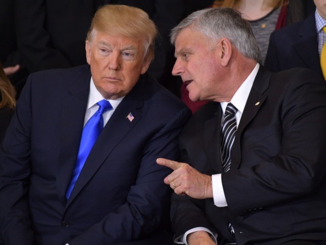 President Donald Trump (L) listens to Billy Graham's eldest son Rev. Franklin Graham during the memorial service for Reverend Billy Graham in the Rotunda of the US Capitol on February 28, 2018 in Washington, DC. / AFP PHOTO / Mandel NGAN (Photo credit should read MANDEL NGAN/AFP via Getty Images)