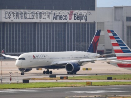 A Delta Airlines Airbus A350 aircraft waits to take off at Beijing airport on July 25, 2018. - Beijing hailed "positive steps" as major US airlines and Hong Kong's flag carrier moved to comply on July 25 with its demand to list Taiwan as part of China, sparking anger on …