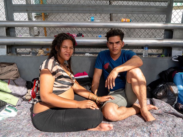 Cuban migrants Dianys Dominguez Aguila, 21, and her boyfriend Andisley Gutierrez Fernandez, 28, have been waiting on the Paso Del Norte Bridge for days, seeking asylum on November 4, 2018 in El Paso, Texas. - Sending thousands of troops to the US-Mexico border to counter a migrant "invasion," questioning the …