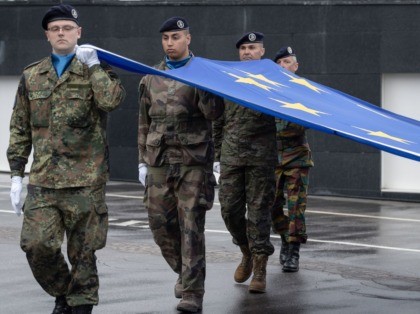 Soldiers of a Eurocorps detachment raise the European Union flag during the open day at the European Parliament in Strasbourg, eastern France, on May 19, 2019, one week ahead of upcoming European elections. - European elections will be held from May 22 to 26, 2019. (Photo by PATRICK HERTZOG / …
