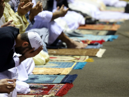 Muslim worshippers offer prayers during Eid al-Fitr at the Velodrome du Champ Fleuri stadium in Saint Denis de la Reunion, on the French Indian Ocean island of La Reunion on June 5, 2019. - Muslims worldwide celebrate Eid al-Fitr marking the end of the fasting month of Ramadan. (Photo by …