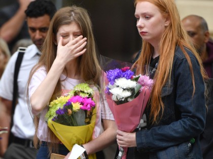 MANCHESTER, ENGLAND - MAY 22: A woman shows emotion during a two minute silence is observed in memory of the victims of the Manchester Bombing in Saint Anne's Square on May 22, 2019 in Manchester, England. The suicide bomb attack took place following a concert at Manchester Arena by US …