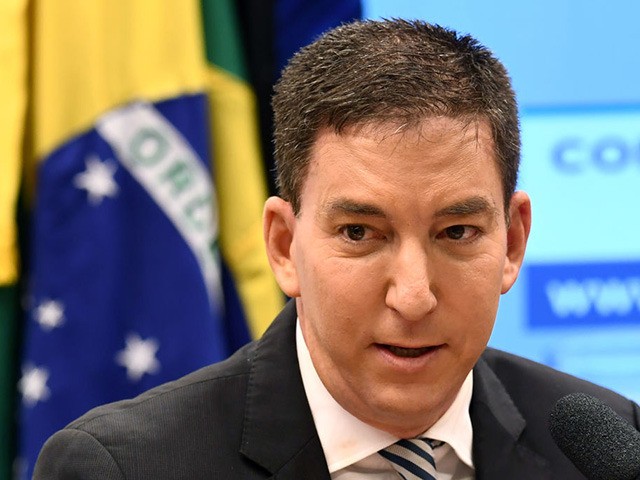 US journalist Glenn Greenwald, founder and editor of The Intercept website gestures during
