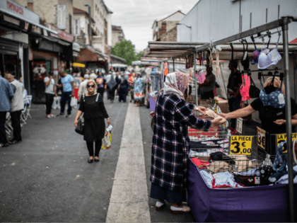 Customers shop at the Aubervilliers Market, north of Paris on July 18, 2019.