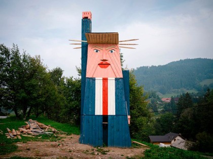 A wooden structure made to resemble US President Donald Trump is constructed in the village of Sela pri Kamniku, about 20 miles northeast of Ljubljana in Slovenia, the home country of Trump's wife on August 28, 2019. - The statute which is nearly 8 meters tall has been built on …