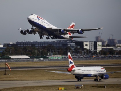 A British Airways aeroplane takes off from the runway at Heathrow Airport's Terminal