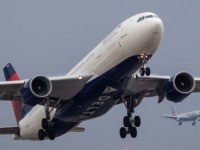 LONDON, ENGLAND - SEPTEMBER 09: A Delta Airlines and American Airlines flights comes in to land at Heathrow on September 9, 2019 in London, England. British Airways pilots have begun a 48 hour 'walkout', grounding most of its flights over a dispute about the pay structure of it's pilots. (Photo …