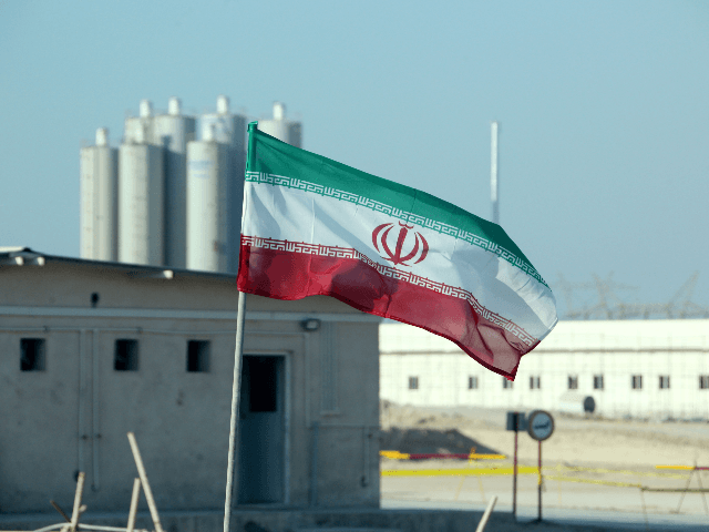 A picture taken on November 10, 2019, shows an Iranian flag in Iran's Bushehr nuclear power plant, during an official ceremony to kick-start works on a second reactor at the facility. - Bushehr is Iran's only nuclear power station and is currently running on imported fuel from Russia that is closely monitored by the UN's International Atomic Energy Agency. (Photo by ATTA KENARE / AFP) (Photo by ATTA KENARE/AFP via Getty Images)