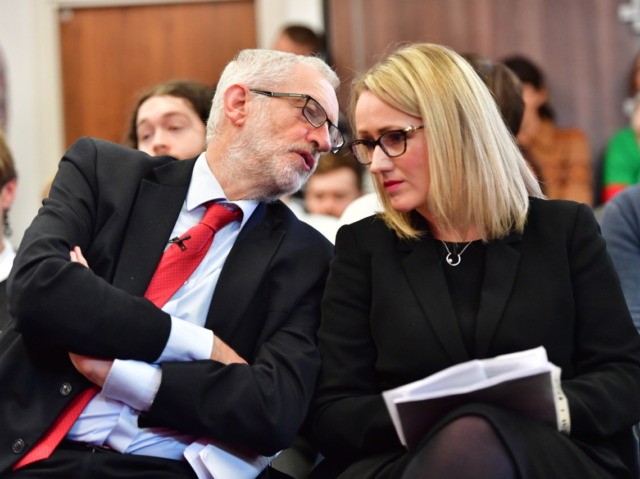 LANCASTER, ENGLAND - NOVEMBER 15: Labour leader Jeremy Corbyn and Shadow Secretary of State for BEIS Rebecca Long-Bailey wait to address the audience at the University of Lancaster on November 15, 2019 in Lancaster, England. The Labour leader has announced a major new digital infrastructure policy including free broadband for …