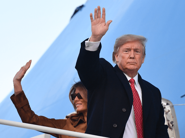 US President Donald Trump and First Lady Melania Trump wave as they make their way to board Air Force One before departing from Andrews Air Force Base in Maryland on November 26, 2019. - Trump is heading to Florida for a rally and to spend the Thanksgiving holiday at his …