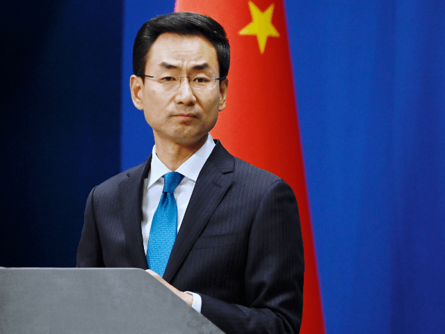 Chinas Ministry of Foreign Affairs spokesman Geng Shuang listens to a question during a briefing in Beijing on November 28, 2019. - China's foreign ministry summoned the US ambassador on November 28, urging Washington to refrain from applying a bill supporting Hong Kong's pro-democracy movement to "avoid further damage" to …