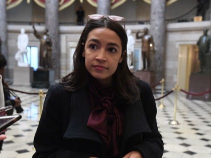 Rep. Alexandria Ocasio-Cortez(D-NY) talks with reporters at the US Capitol, as the House readies for a historic vote on December 18, 2019 in Washington, DC. - President Donald Trump faces becoming only the third US leader ever to be impeached on December 18, 2019 with the House of Representatives set …