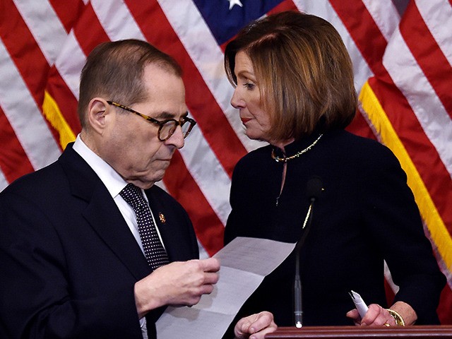 US Speaker of the House Nancy Pelosi (R) and House Judiciary Chairman Jerry Nadler walk aways after holding a press conference after the House passed Resolution 755, Articles of Impeachment Against President Donald J. Trump, at the US Capitol in Washington, DC, on December 18, 2019. - The US House …