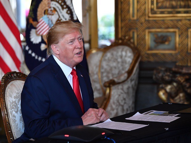 US President Donald Trump makes a video call to the troops stationed worldwide at the Mar-a-Lago estate in Palm Beach Florida, on December 24, 2019. (Photo by Nicholas Kamm / AFP) (Photo by NICHOLAS KAMM/AFP via Getty Images)