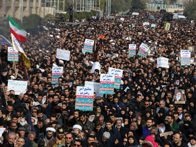 Iranians hold anti-US banners during a demonstration in the capital Tehran on January 3, 2
