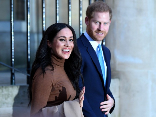 Britain's Prince Harry, Duke of Sussex and Meghan, Duchess of Sussex reacts as they leave after her visit to Canada House in thanks for the warm Canadian hospitality and support they received during their recent stay in Canada, in London on January 7, 2020. (Photo by DANIEL LEAL-OLIVAS / POOL …