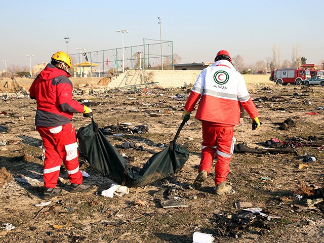 EDITORS NOTE: Graphic content / Rescue teams recover a body after a Ukrainian plane carrying 176 passengers crashed near Imam Khomeini airport in the Iranian capital Tehran early in the morning on January 8, 2020, killing everyone on board. - The Boeing 737 had left Tehran's international airport bound for …