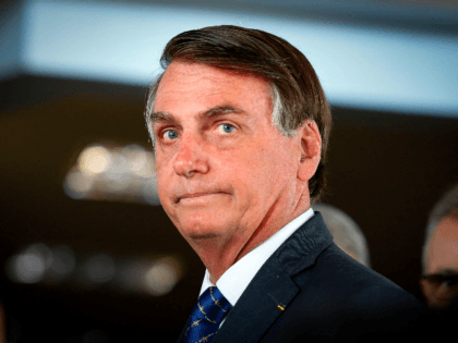 Brazilian President Jair Bolsonaro arrives for a press conference on electricity and gasol