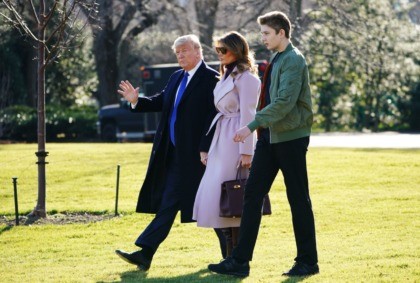 US President Donald Trump, First Lady Melania Trump and son Barron Trump make their way to board Marine One from the South Lawn of the White House in Washington, DC on January 17, 2020. - Trump is traveling to Palm Beach, Florida. (Photo by MANDEL NGAN / AFP) (Photo by …