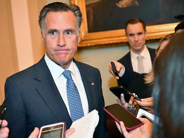 Sen. Mitt Romney(R-UT) speaks to reporters as he arrives for the Senate impeachment trial