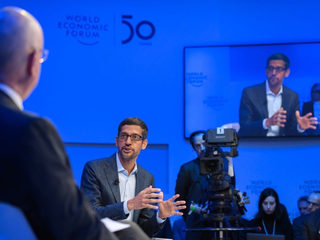 Alphabet CEO Sundar Pichai gestures during a session with World Economic Forum (WEF) founder and executive chairman Klaus Schwab at the World Economic Forum (WEF) annual meeting in Davos, on January 22, 2020. (Photo by Fabrice COFFRINI / AFP) (Photo by FABRICE COFFRINI/AFP via Getty Images)