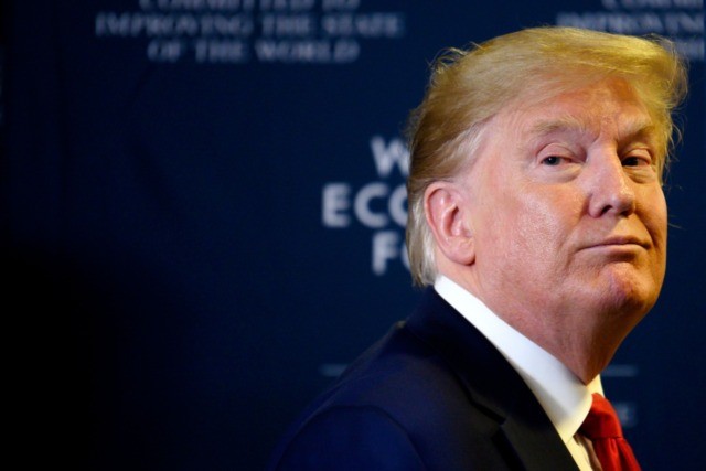 US President Donald Trump looks back as a question from the press is shouted after a press conference at the World Economic Forum in Davos, Switzerland, on January 22, 2020. (Photo by JIM WATSON / AFP) (Photo by JIM WATSON/AFP via Getty Images)