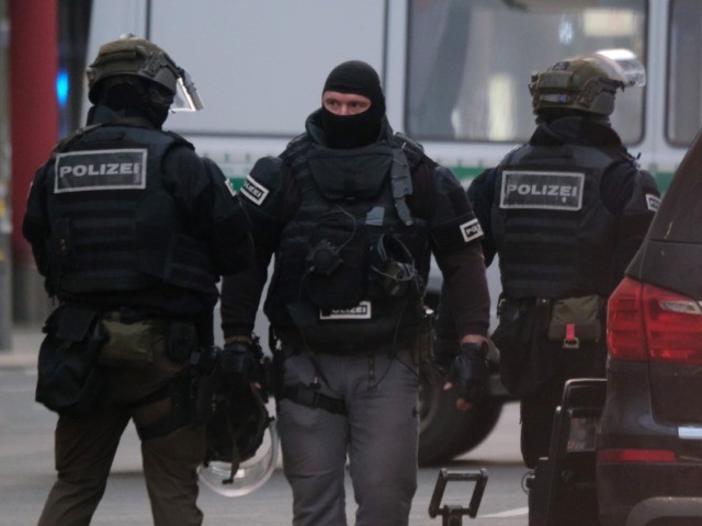 BERLIN, GERMANY - DECEMBER 30: Heavily-armed police stand at the site of a reported shooti